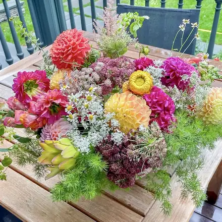A bright arrangement of dahlias and garden flowers