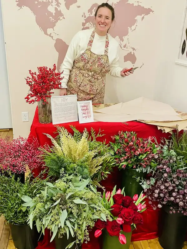 Alba at a winter flower stand with red and green stems